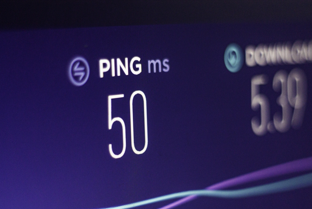 Network latency displayed as a ping test result showing 50 ms response time on a network performance dashboard