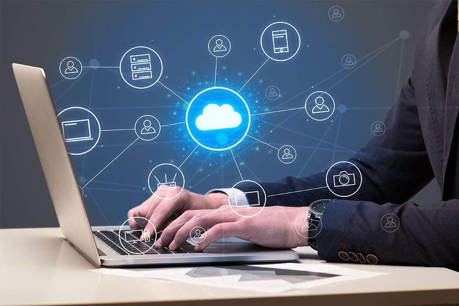 Man typing on laptop concept image for cloud solutions