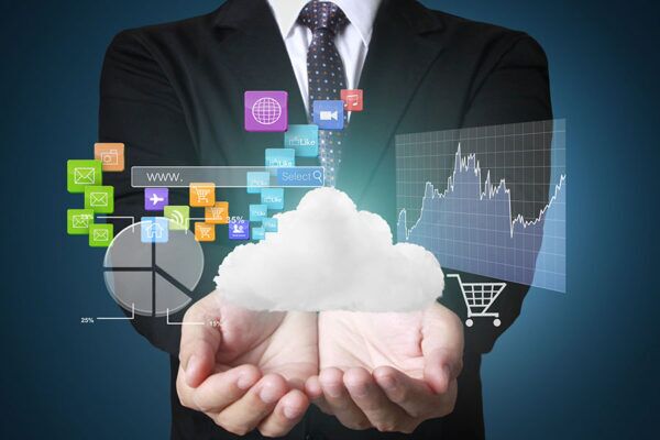 A business professional holding a cloud surrounded by various digital icons, symbolizing the benefits of cloud integration for business growth