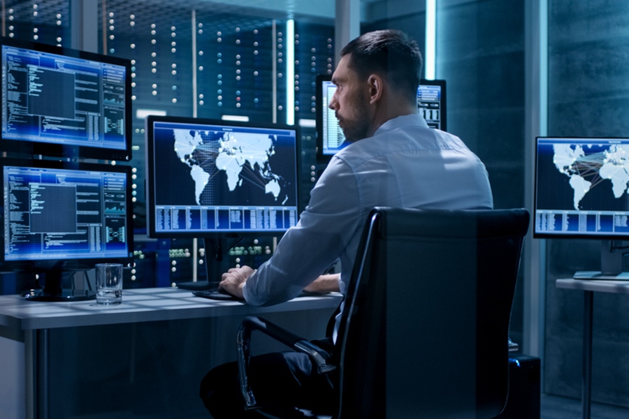 Business professional analyzing graphs on a computer, representing concierge IT services in Singapore for data-driven solutions