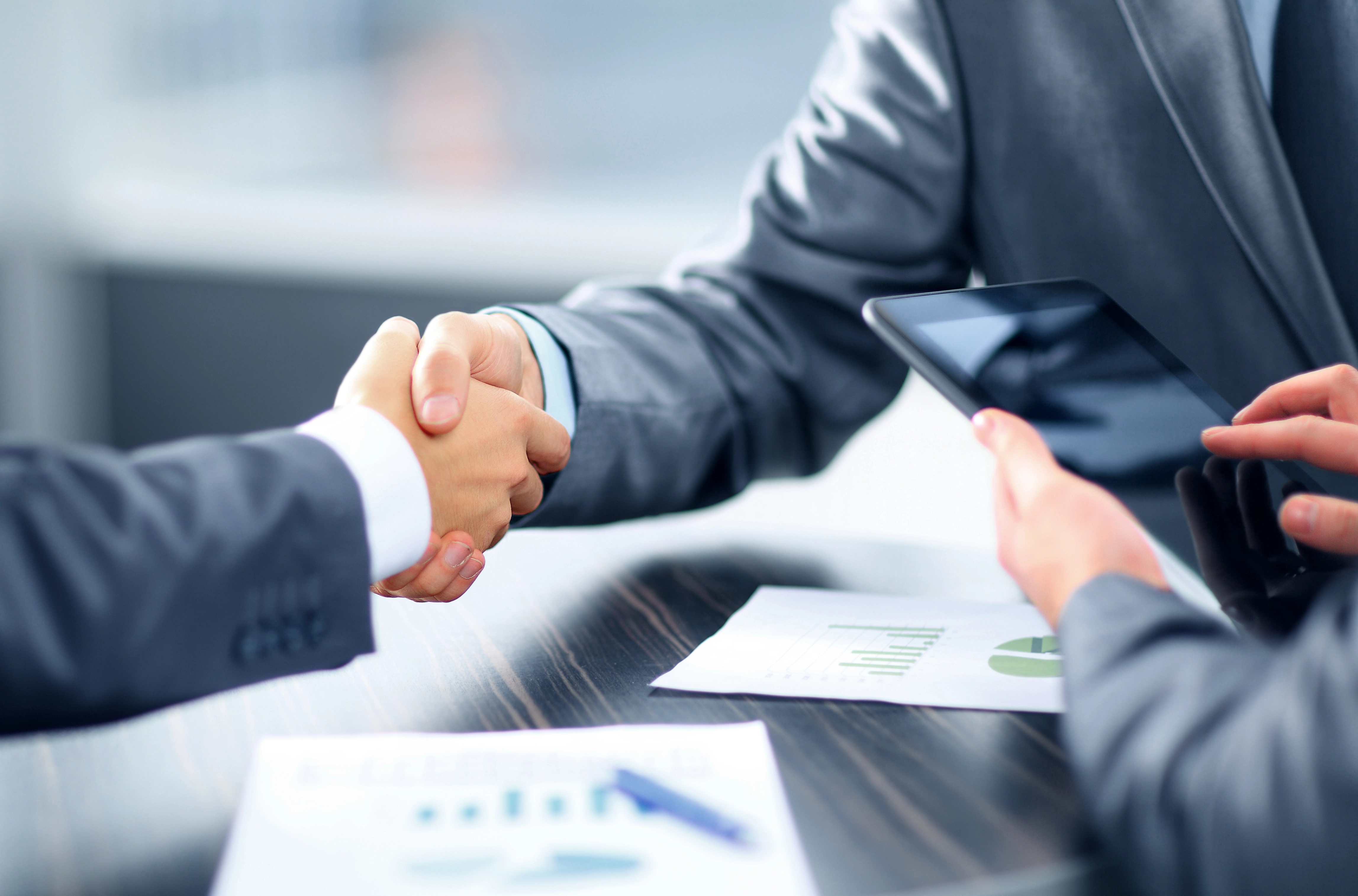 A handshake, concept image for partnership with EIRE Systems