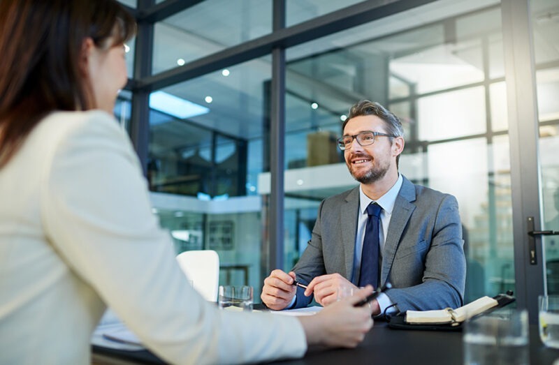 Businessman receiving consultation on wireless assessment services for network optimization Businessman receiving consultation on wireless assessment services for network optimization