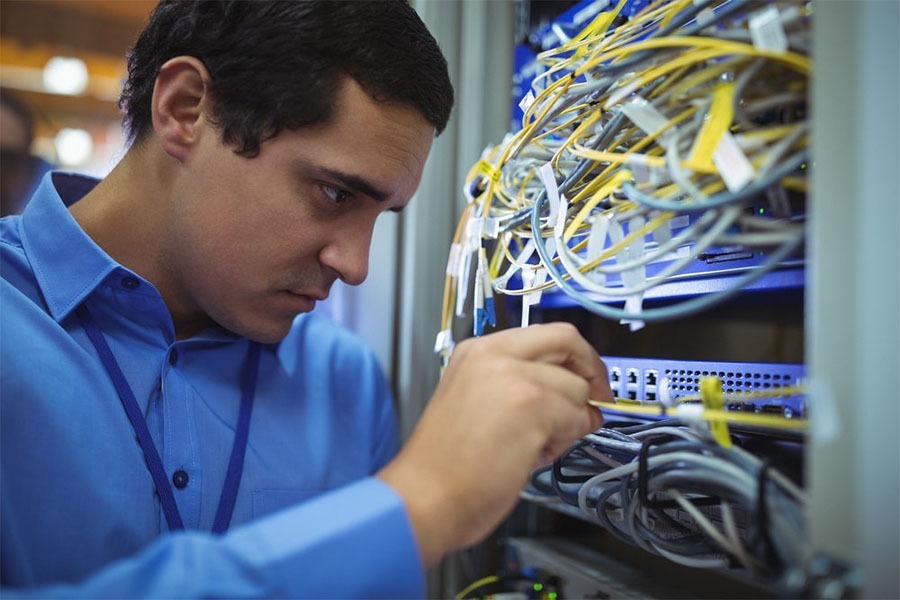 IT checking cables for wireless network concept image for Wi-Fi design services IT checking cables for wireless network concept image for Wi-Fi design services