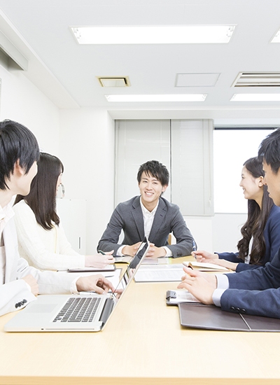 Business professionals strategizing cloud computing solutions with digital overlays representing cloud networks and automation in Japan. Business professionals strategizing cloud computing solutions with digital overlays representing cloud networks and automation in Japan.