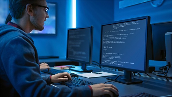 IT specialists conducting a penetration test on the system to improve it. IT specialists are conducting penetration testing on a network to improve its resistance to a cyber attack.