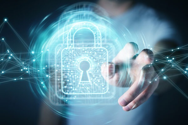 6 Critical Factors to Consider When Outsourcing IT Support Services 5 Businessman utilizing a digital padlock, ensuring data security