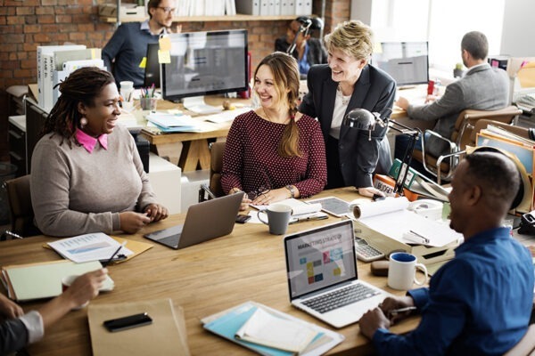 6 Critical Factors to Consider When Outsourcing IT Support Services 6 Team engaged in a collaborative meeting, discussing and communicating ideas effectively