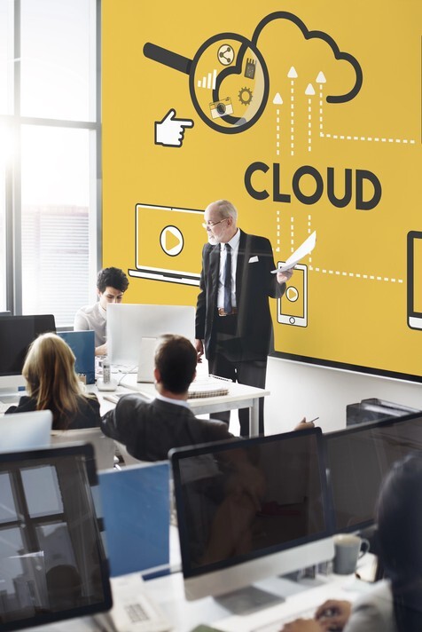 Business professional presenting cloud technology concept in an office, highlighting Singapore Azure cloud services with a collaborative team.