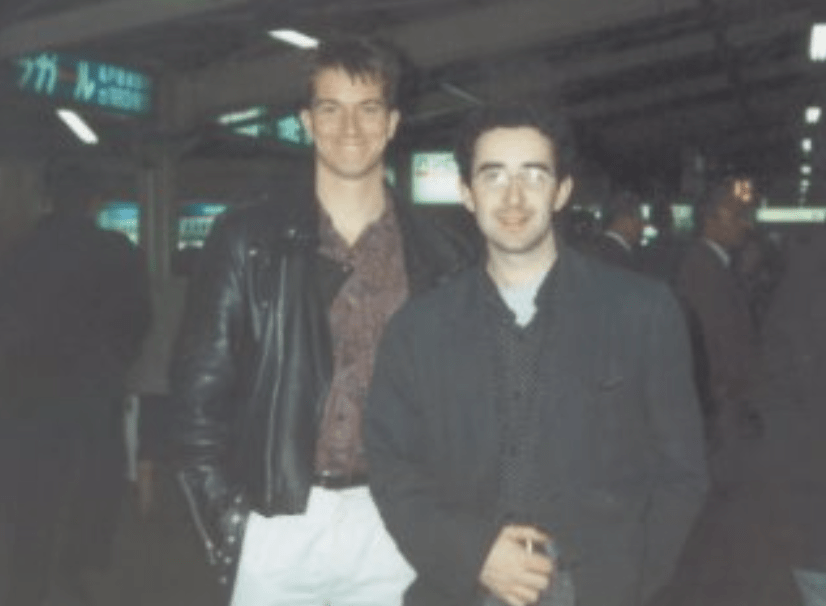 Business professional presenting cloud technology concept in an office, highlighting Singapore Azure cloud services with a collaborative team.