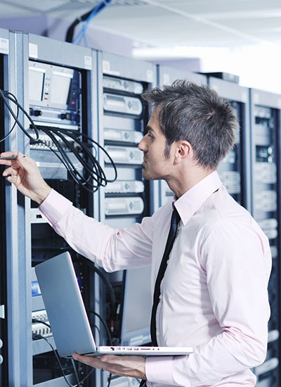 IT technician in Japan assessing network infrastructure for wifi assessment services in Japan, ensuring optimal performance IT technician in Japan assessing network infrastructure for wifi assessment services in Japan, ensuring optimal performance