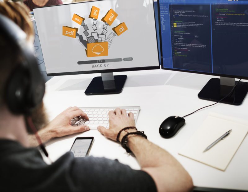 Business Data Backup Strategy: How to Protect Critical Company Data 4 Guy on a computer actively engaged in data backups and exploring 'Differential Backups' as part of his comprehensive data protection strategy