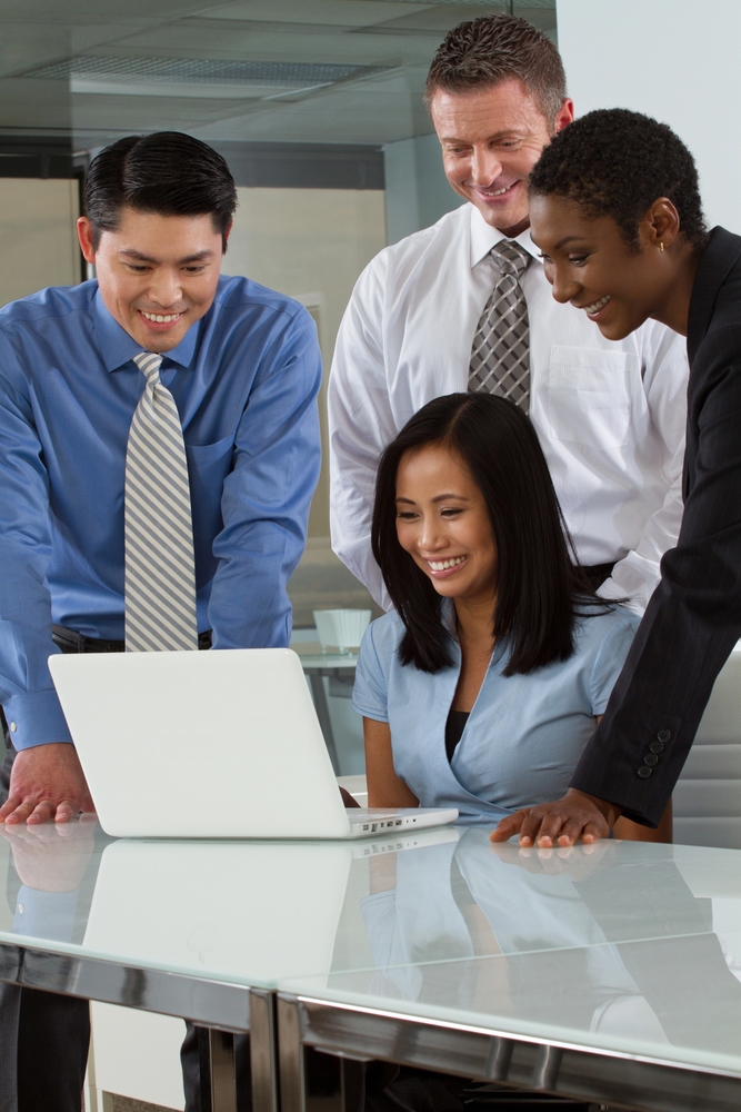 Business Cloud Solutions in Singapore 4 Group of IT experts in Singapore having a meeting.