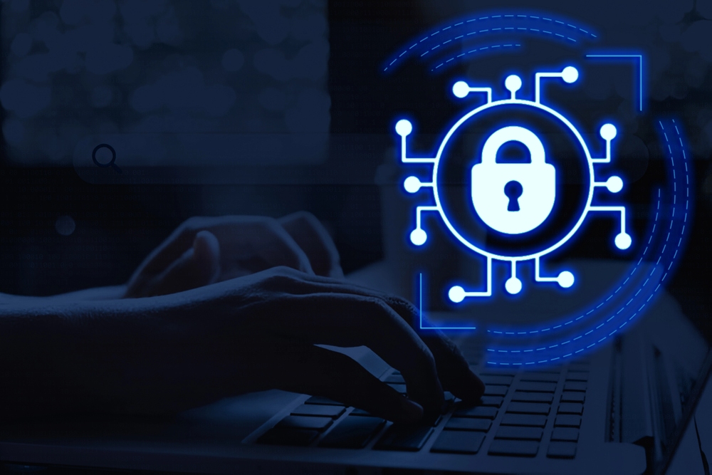 What is Endpoint Management? 2 Endpoint management concept showing a glowing security lock icon over a laptop keyboard