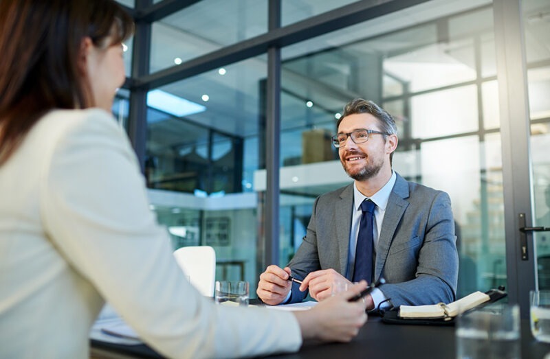 Businessman receiving consultation on wireless assessment services for network optimization